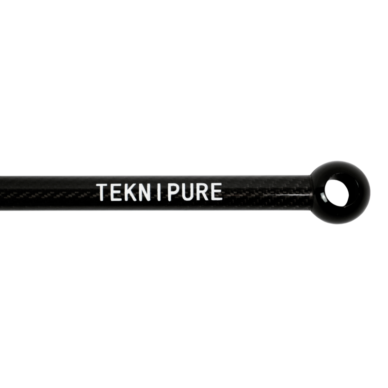 Close-up of a black carbon-fiber rod with a circular loop at the end and the text TEKNI PURE along its length.