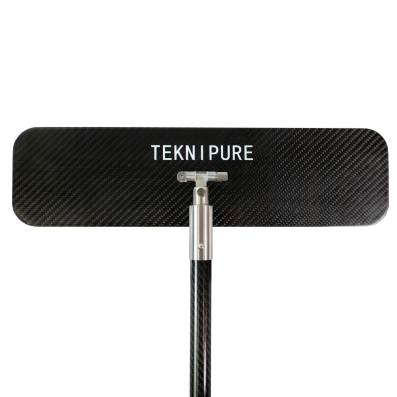 Rectangular carbon-fiber panel with the word 'TEKNIPURE' in white letters mounted on a metal pole.