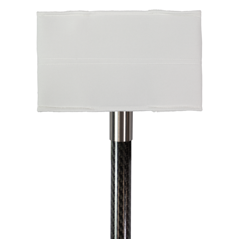 White rectangular fabric lampshade atop a chrome floor lamp stem.