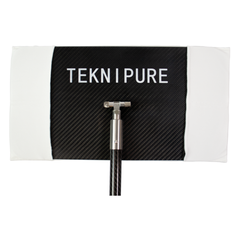 Black carbon-fiber panel with the white TEKNI PURE logo and a metal clamp/stand protruding from the bottom center against a white border.